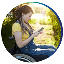 Woman in wheel chair on her cell phone