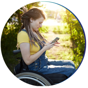Young Woman in Wheelchair Texting while enjoying the outdoors
