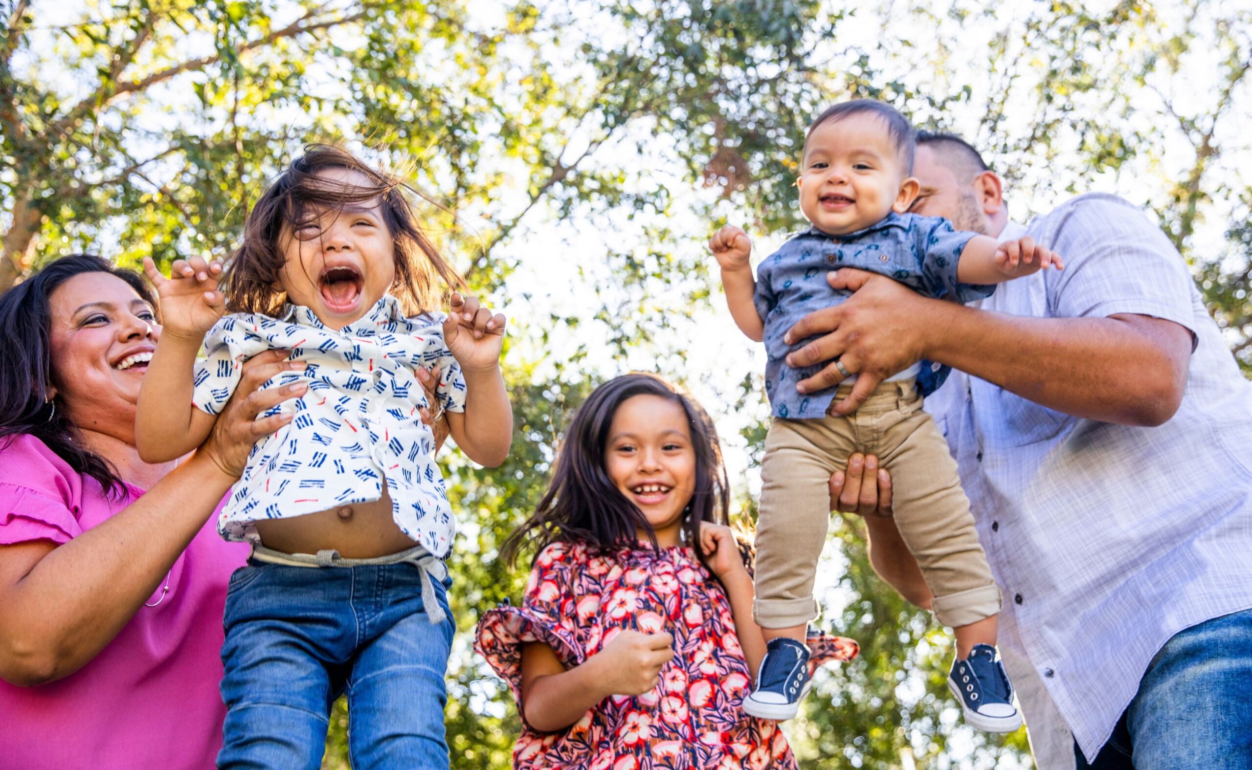 an image of a family having fun in the park